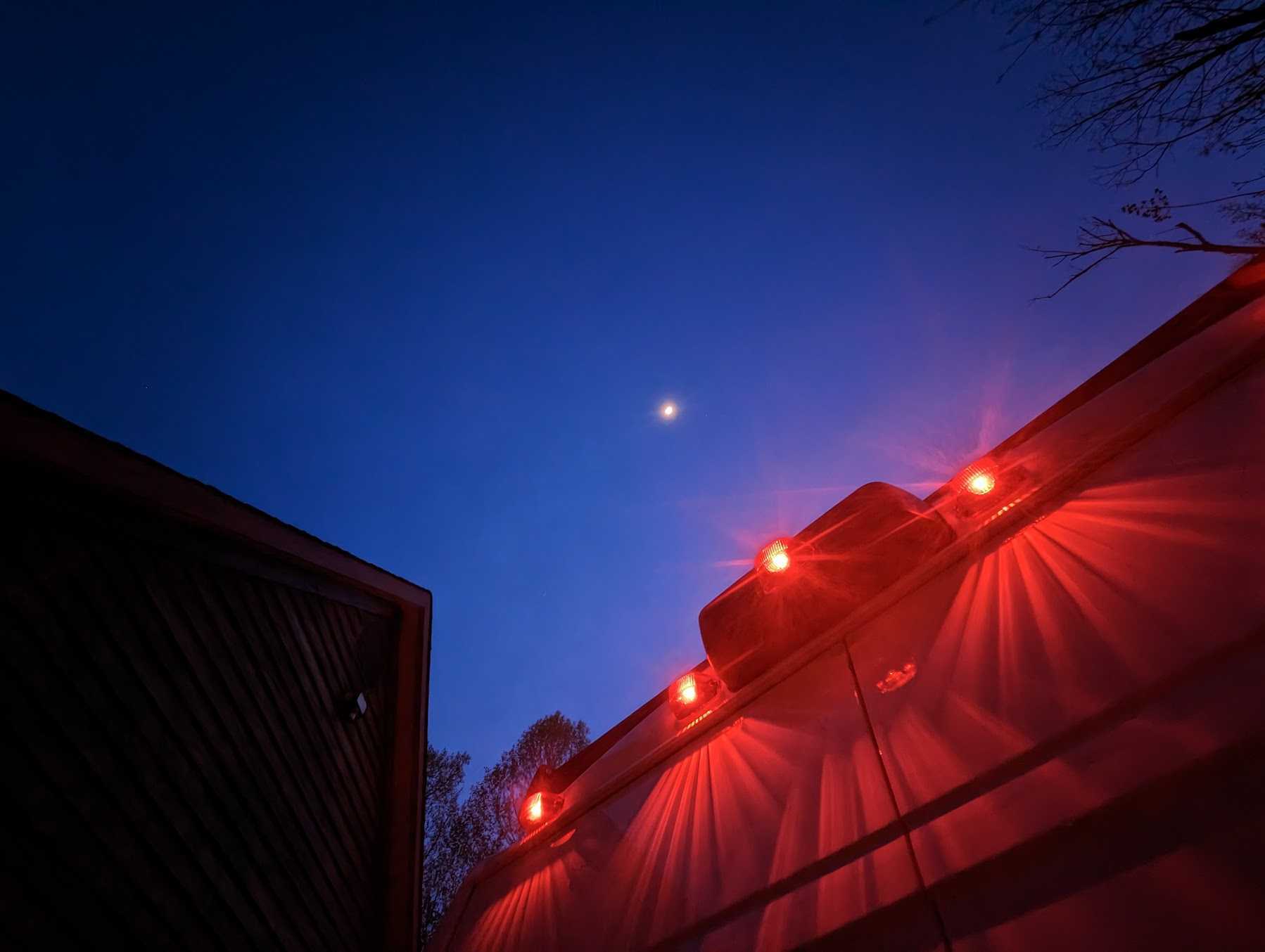 red brake lights against the evening sky